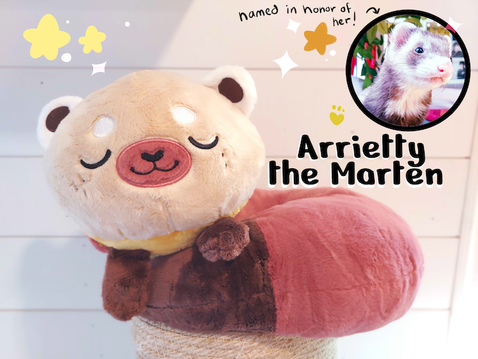 Plush neck pillow of Arrietty the Pine Marten with a photo of her namesake ferret 