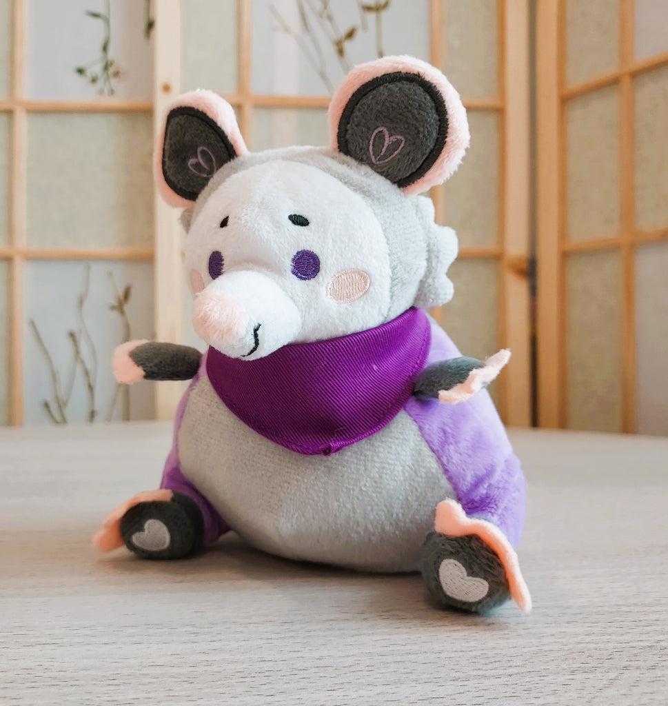 BeanBuds beanie plush of Plum Possum wearing a purple bandana