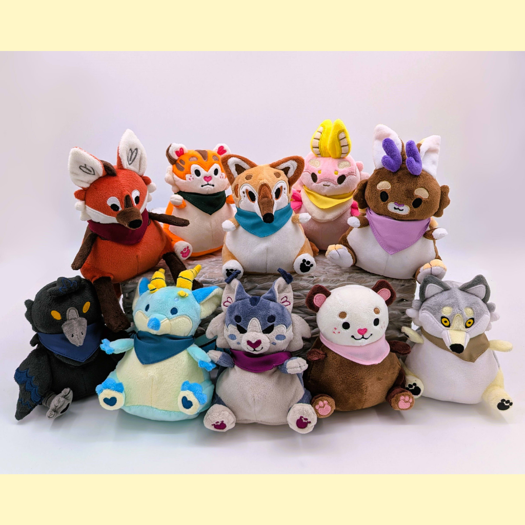 Collection of various animal plush toys on a white background