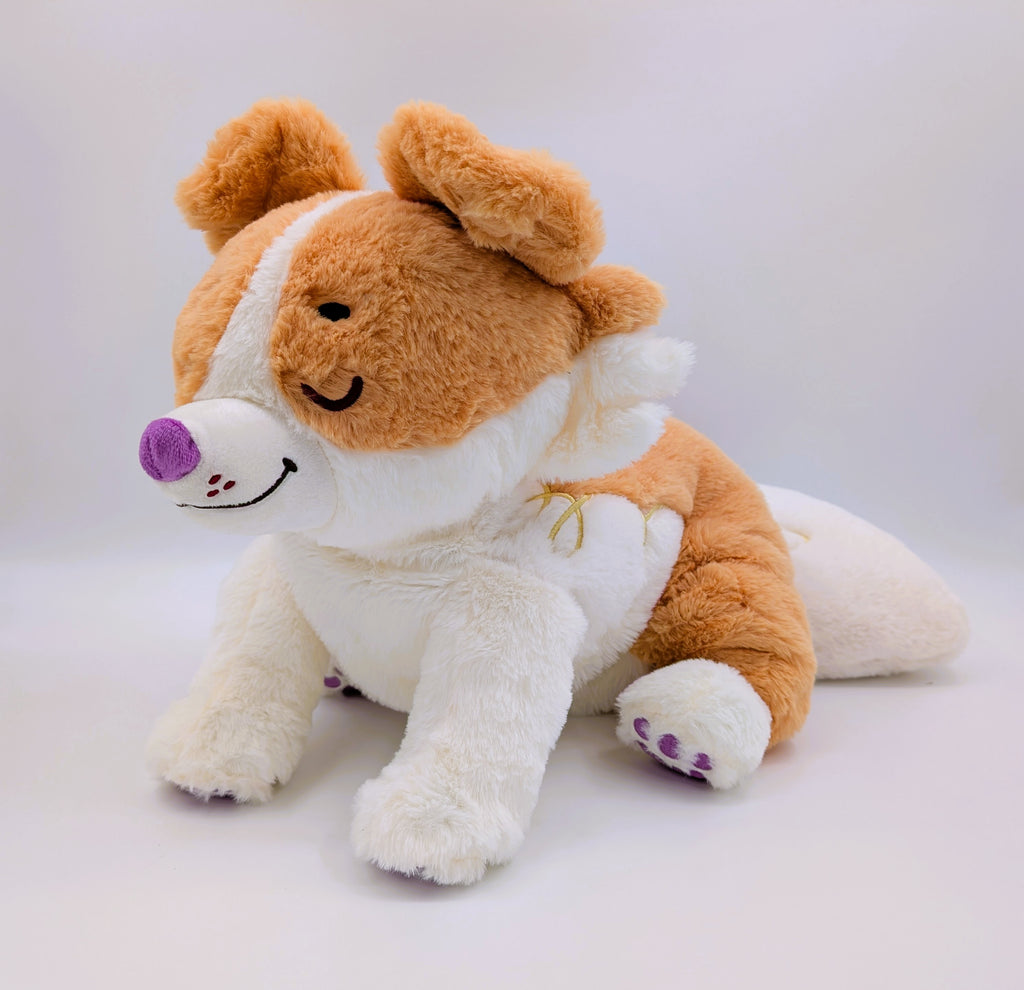 Plush toy of a red border collie with purple nose