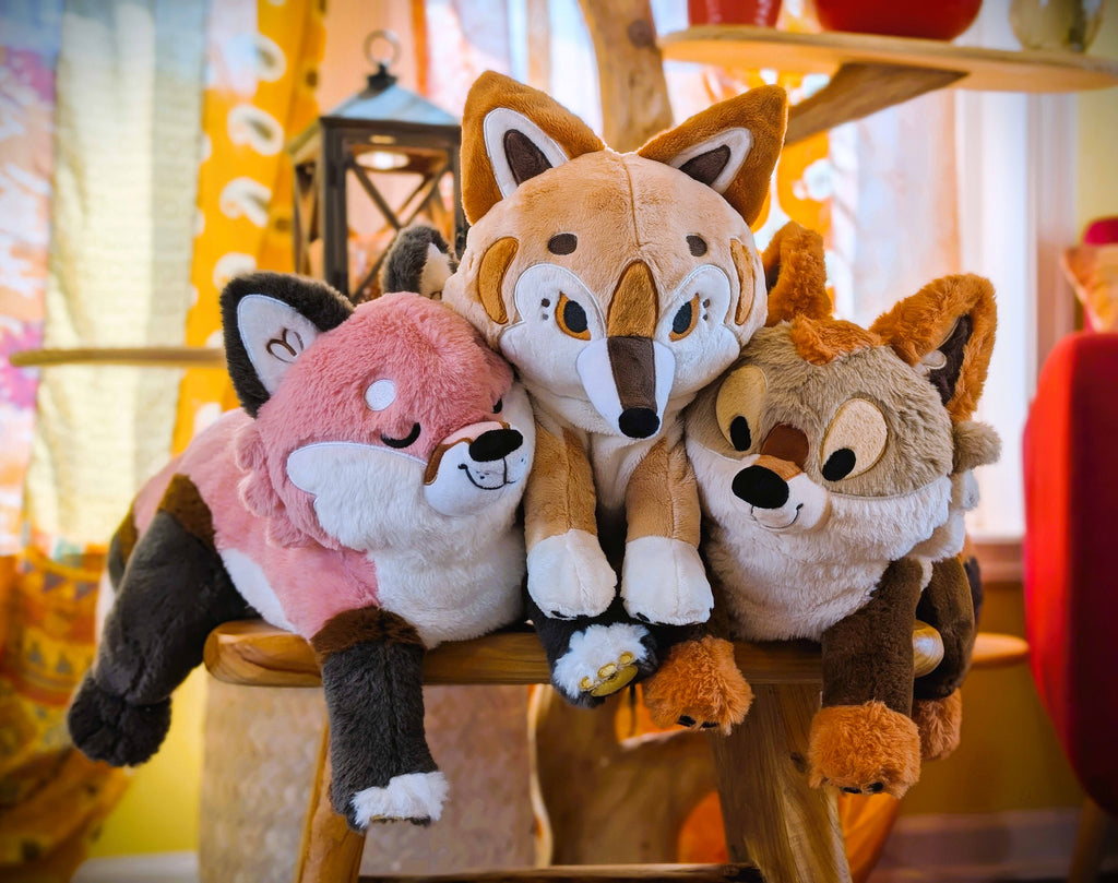 Plush toys of Litha the Coyote Pup, Hobart the Thylacine, and Chiffon the Fox