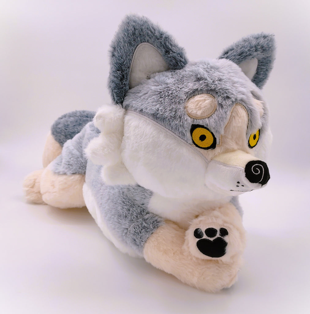 BigHugs weighted Biscuit white wolf plush pillow in a laying pose