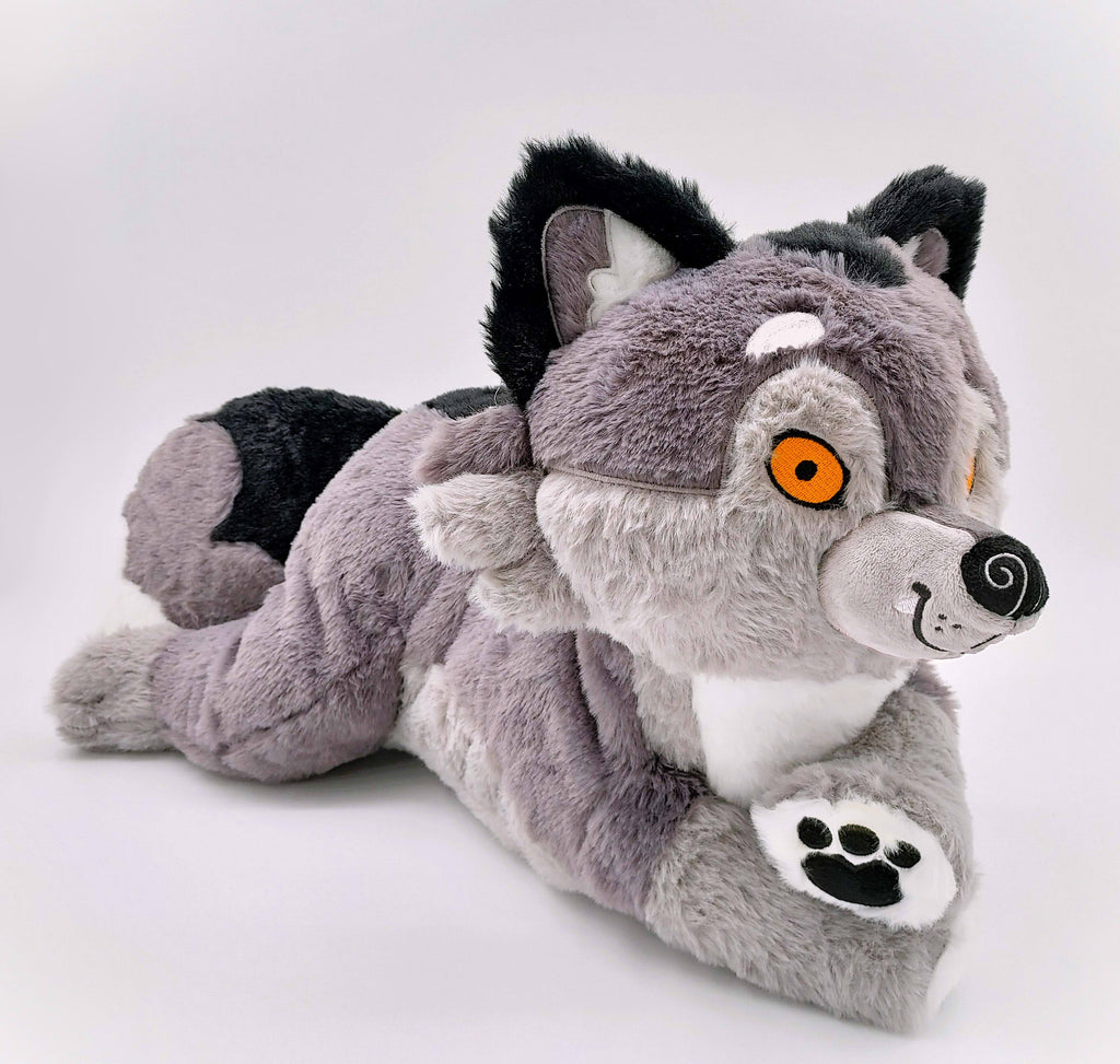 BigHugs weighted Wolfgang dark grey wolf plush pillow in a laying pose