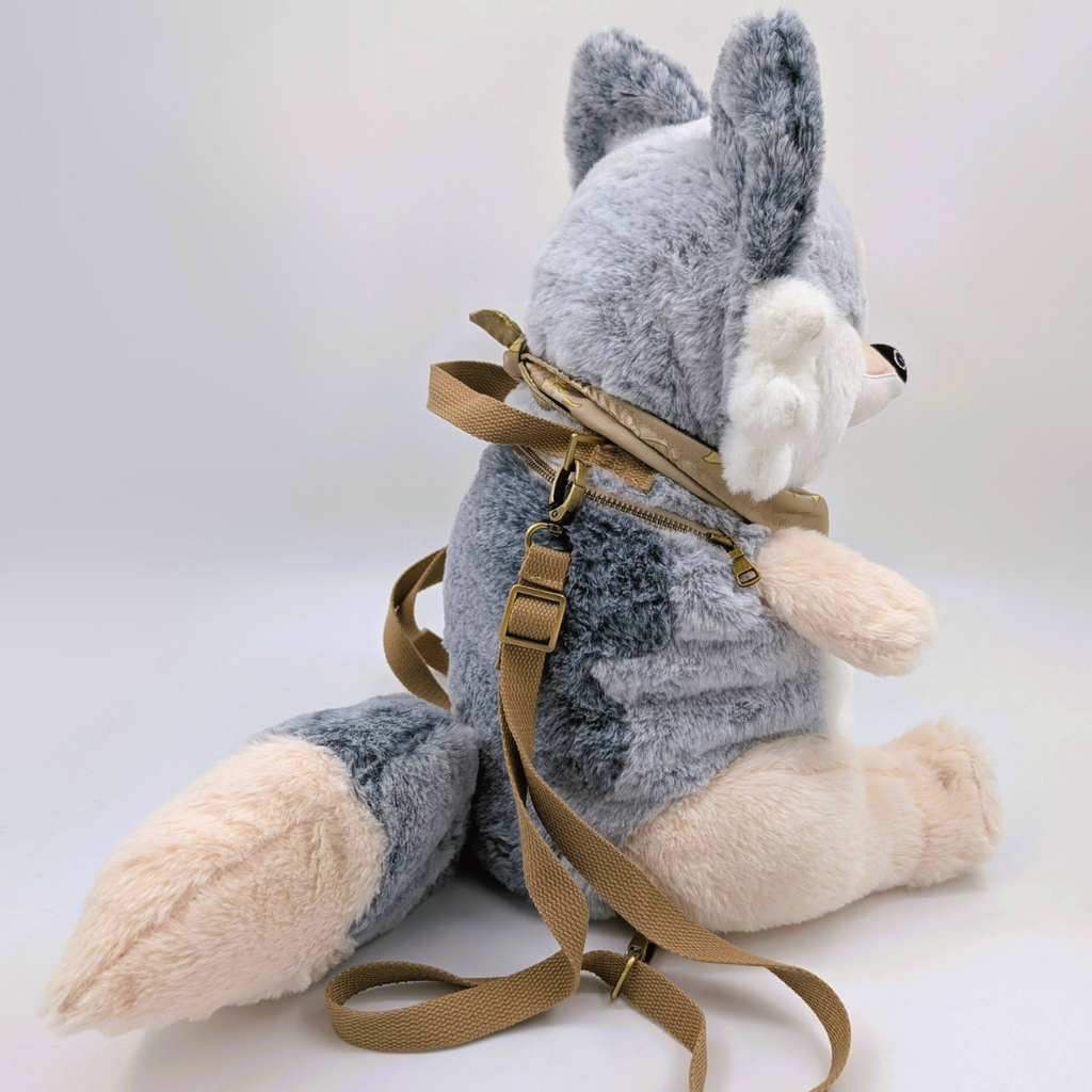 Side view of a plush backpack of a wolf 