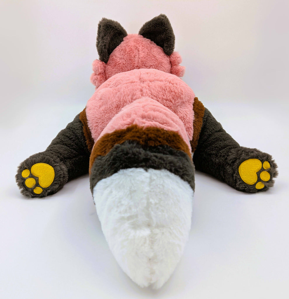 Back view of a pllush toy of Chiffon the red fox
