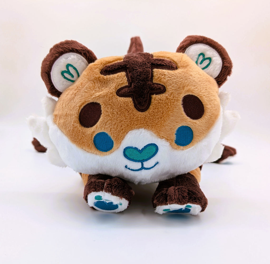 Front view of a plush of Cornflakes the Tiger and Shark hybrid