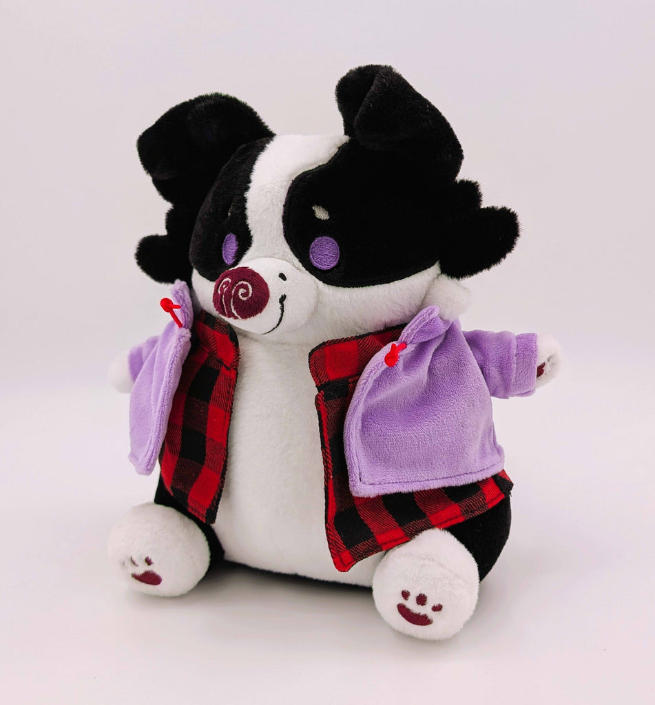 CosyPaws plush of Starry Pup the black and white border collie wearing a purple jacket