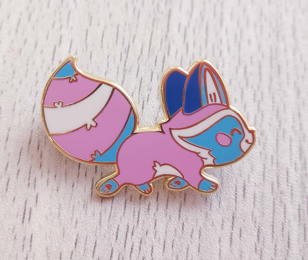 Enamel pin of Egg the Trans Raccoon going for a walk