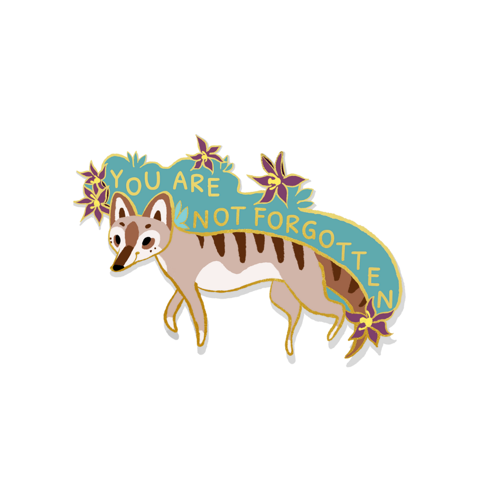 Enamel pin of a thylacine with text that says "You are not forgotten."