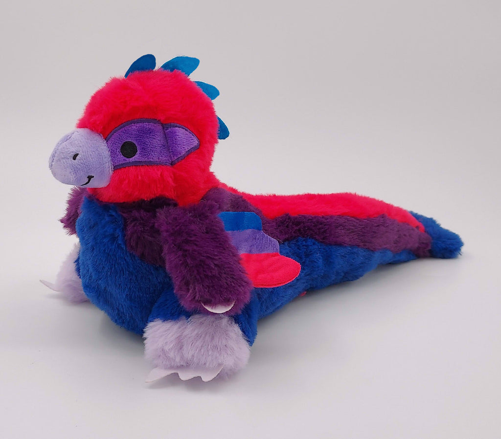 Plush of Jelly Donut the pink, blue, and purple utahraptor