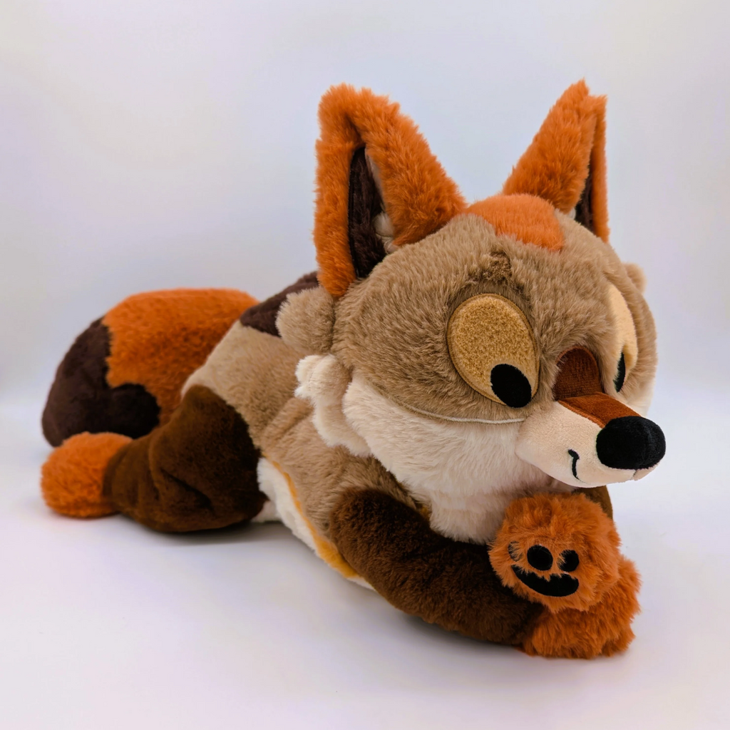 Plush toy of Litha the coyote pup