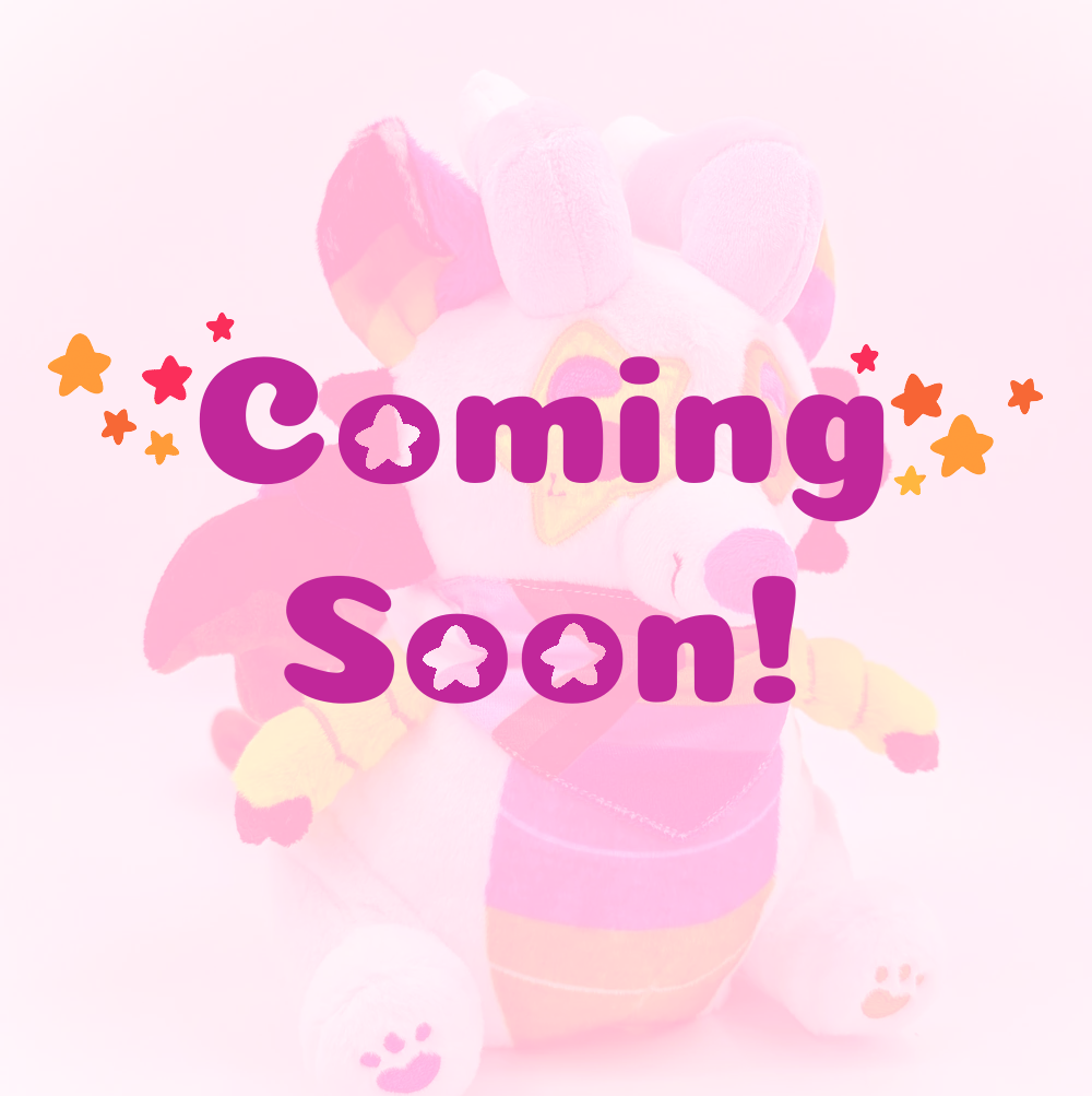 Plush toy of Mixtape the rainbow sparkledog dragon  with coming soon text