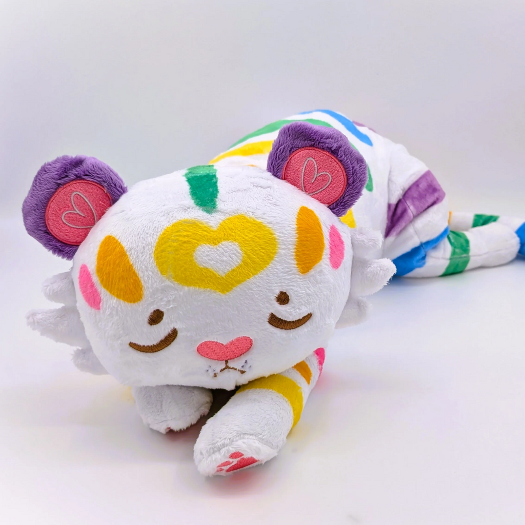 Plush toy of Mochi the rainbow and white tiger