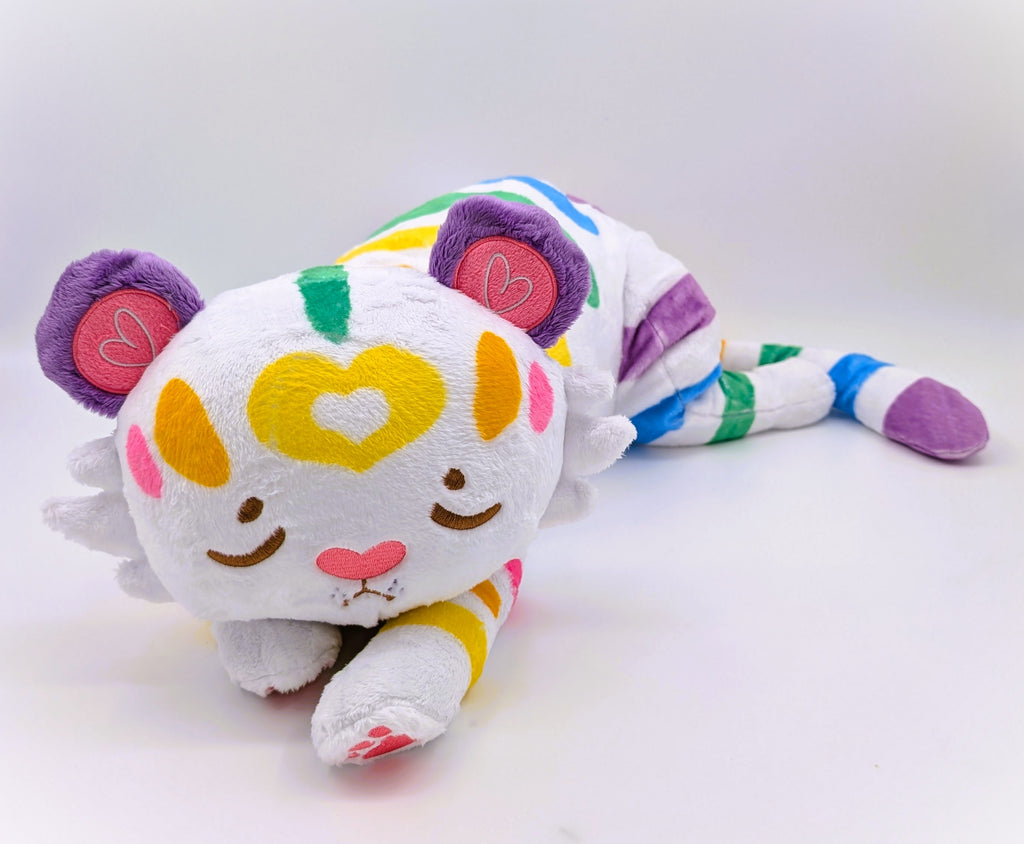 Plush toy of Mochi the pastel rainbow tiger