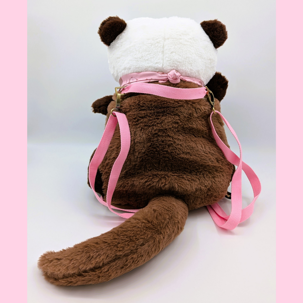 Back view of a plush backpack of an otter with pink straps