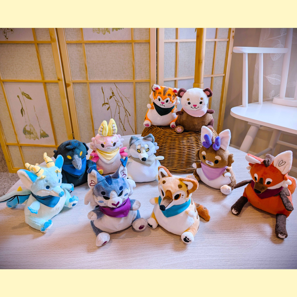 Collection of colorful animal plush toys on a wooden surface with a decorative background.