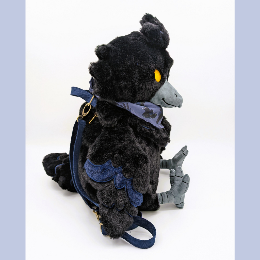 Side view of a plush backpack of a raven