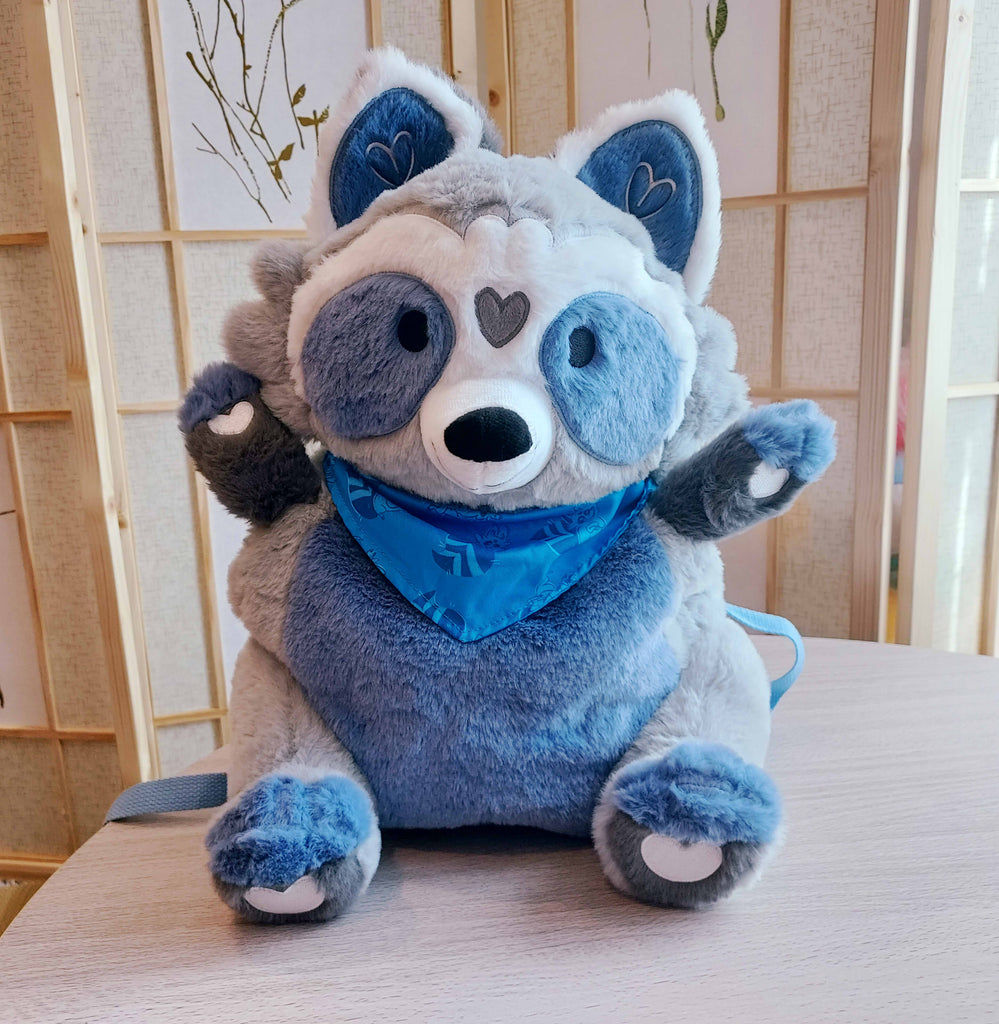 Plush backpack of Peanut the racoon asking for a hug