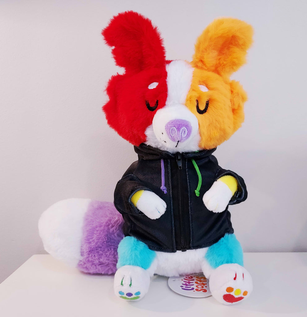 Plush toy of a rainbow border collie wearing a black hoodie