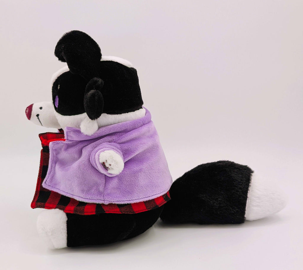 Side view of CosyPaws plush of Starry Pup the black and white border collie wearing a purple jacket