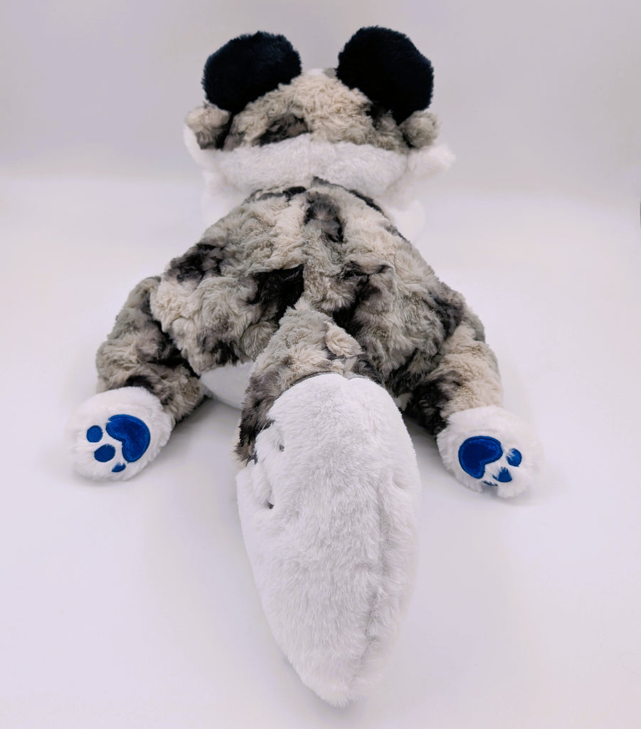 Back view of a blue merle border collie plush with blue paw pads