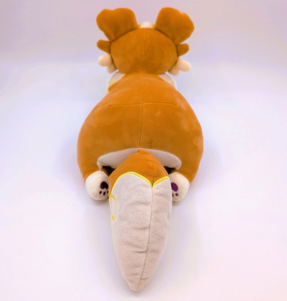 Back view of a plush toy of an orange border collie