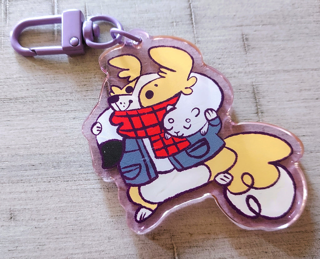 Acrylic keychain charm of Sunny Pup the Red Border Collie and Pippin the Ermine