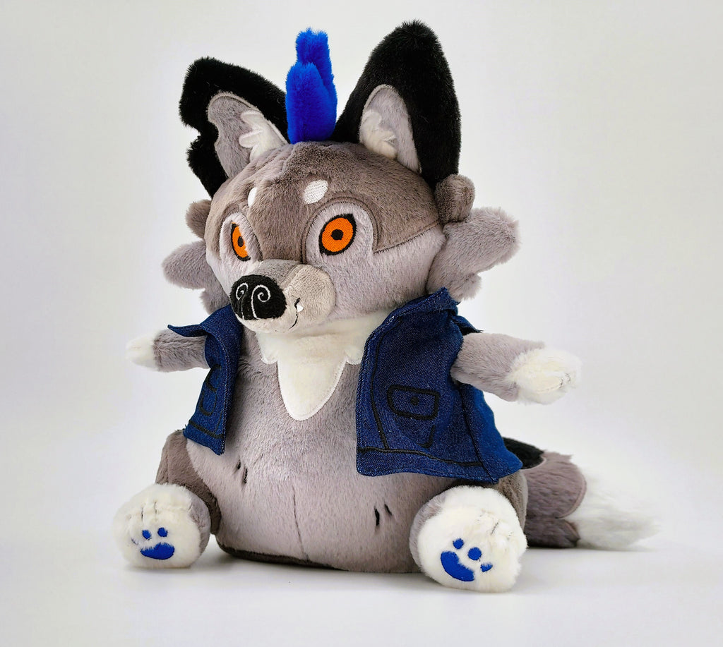 Plush toy of Wolfgang the werewolf with blue hair and a blue denim vest 