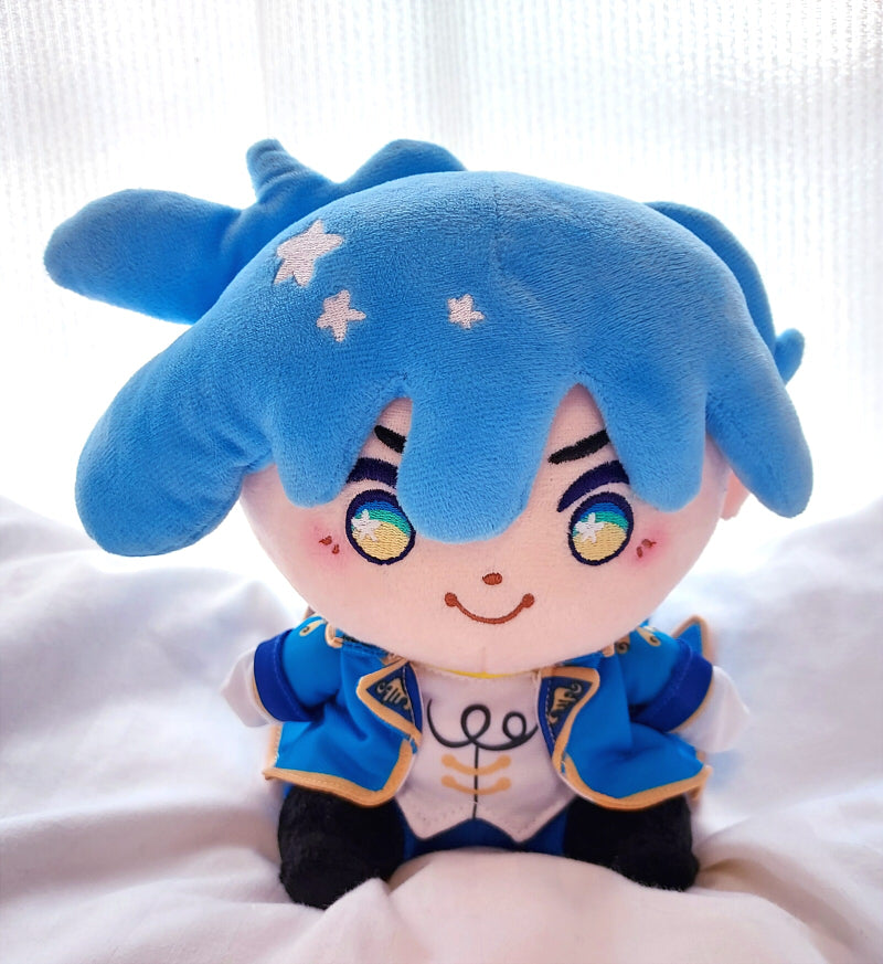 Plush doll of Orion the Parrot Pirate. He has blue hair and is wearing a blue jacket and white shirt.