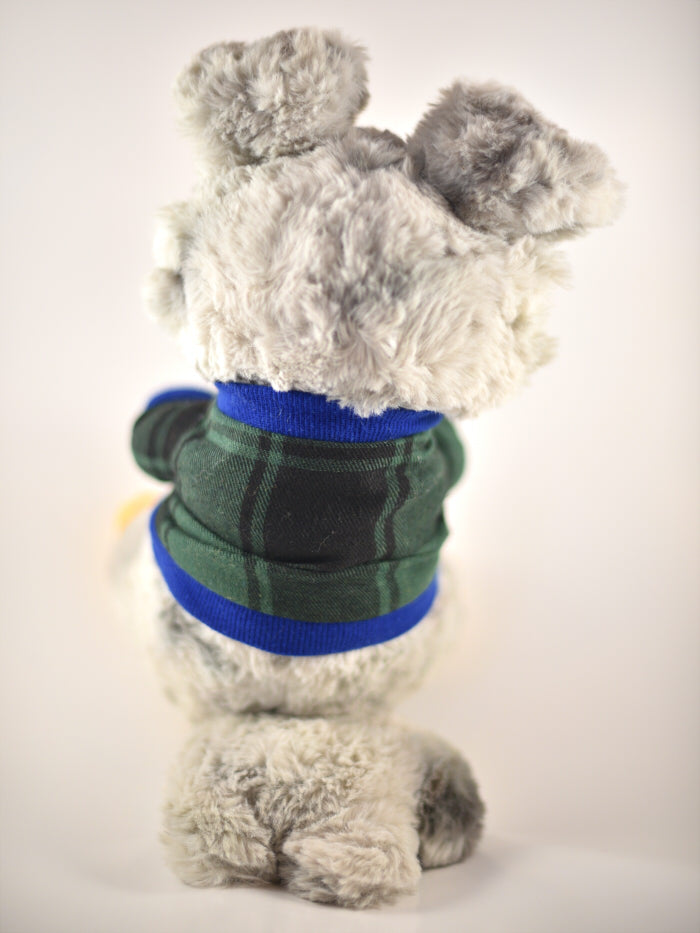 Back view of a plush toy of an Australian shepherd wearing a green and blue plaid sweater