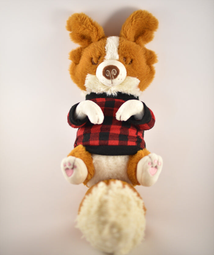 Plush toy of a red border collie wearing red and black check sweater