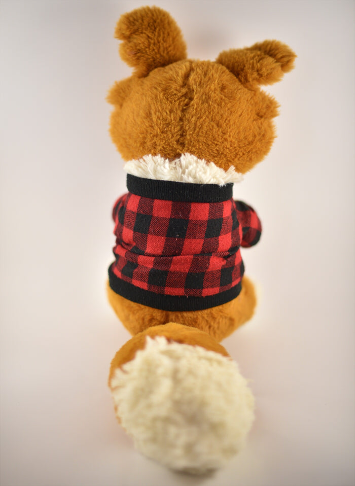 Back view of a plush of a red border collie wearing red and black check sweater